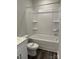 Simple bathroom with shower-tub combo and modern sink at 5112 Heathland Dr # 75, Charlotte, NC 28215