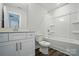 Clean bathroom featuring a vanity, toilet, and shower-tub combination at 5112 Heathland Dr # 75, Charlotte, NC 28215