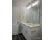 Bathroom featuring a double sink vanity with white cabinets and a large mirror at 5112 Heathland Dr # 75, Charlotte, NC 28215