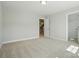 The bedroom features an open doorway and closet, and is illuminated by a flush mount light fixture at 5112 Heathland Dr # 75, Charlotte, NC 28215