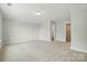 Spacious bedroom with neutral carpeting and a view of a walk-in closet at 5112 Heathland Dr # 75, Charlotte, NC 28215