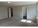 Bedroom featuring neutral carpet, grey walls, and white trim at 5112 Heathland Dr # 75, Charlotte, NC 28215