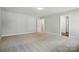 Spacious bedroom featuring neutral carpet, recessed lighting, and an attached closet at 5112 Heathland Dr # 75, Charlotte, NC 28215