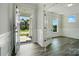 Bright foyer with hardwood floors and an open view into another room at 5112 Heathland Dr # 75, Charlotte, NC 28215
