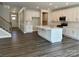 Modern kitchen with white cabinets, stainless steel appliances, and large center island at 5112 Heathland Dr # 75, Charlotte, NC 28215