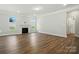 Spacious living room features hardwood floors, bright windows, and a fireplace at 5112 Heathland Dr # 75, Charlotte, NC 28215