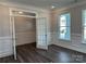 Office space with paneled walls and window views of the exterior at 5112 Heathland Dr # 75, Charlotte, NC 28215