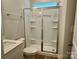 Modern bathroom with a glass-enclosed shower featuring built-in shelving and tile accents at 5115 Heathland Dr # 47, Charlotte, NC 28215