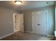 Comfortable bedroom with a spacious closet offering ample storage at 5115 Heathland Dr # 47, Charlotte, NC 28215