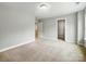 Bedroom featuring neutral carpet and paint and two doorways at 5115 Heathland Dr # 47, Charlotte, NC 28215