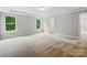 An empty bedroom with neutral paint, carpet floors, and tray ceilings at 5115 Heathland Dr # 47, Charlotte, NC 28215