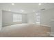 A large bonus room with carpet floors, recessed lighting, and a window at 5115 Heathland Dr # 47, Charlotte, NC 28215