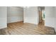 Bright dining room featuring hardwood floors, elegant wainscoting, and an adjacent doorway at 5115 Heathland Dr # 47, Charlotte, NC 28215