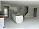 Open-concept kitchen with a large island and white cabinets, perfect for entertaining and modern living at 5115 Heathland Dr # 47, Charlotte, NC 28215