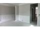 Spacious living area showcasing classic white trim, molding, and wainscoting details for an elegant touch at 5115 Heathland Dr # 47, Charlotte, NC 28215