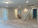Spacious living room with neutral carpet and abundant natural light at 5115 Heathland Dr # 47, Charlotte, NC 28215