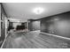 Basement featuring luxury vinyl plank flooring and a tiered movie area with leather recliners at 8905 Valleymoon Ln, Charlotte, NC 28214