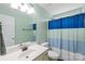 Bathroom featuring white vanity, neutral walls, and blue striped shower curtain at 8905 Valleymoon Ln, Charlotte, NC 28214