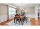 Stylish dining area features modern lighting, natural light, and an open layout at 8905 Valleymoon Ln, Charlotte, NC 28214