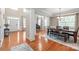 Elegant dining room boasts hardwood floors, natural light, and a view of the grand piano at 8905 Valleymoon Ln, Charlotte, NC 28214