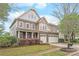 Charming two-story home features a manicured lawn, two-car garage, and inviting front porch at 8905 Valleymoon Ln, Charlotte, NC 28214