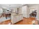 Bright kitchen with an island, stainless appliances, granite countertops, and hardwood floors at 8905 Valleymoon Ln, Charlotte, NC 28214
