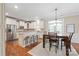 Eat-in kitchen featuring stainless appliances, granite counters, and a breakfast bar at 8905 Valleymoon Ln, Charlotte, NC 28214