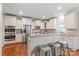 Bright eat-in kitchen offers stainless appliances, granite countertops, and ample cabinet space at 8905 Valleymoon Ln, Charlotte, NC 28214