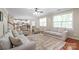 Open concept living room with hardwood floors, fireplace and access to kitchen at 8905 Valleymoon Ln, Charlotte, NC 28214