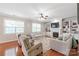 Cozy living room with natural light, a fireplace, and comfortable seating at 8905 Valleymoon Ln, Charlotte, NC 28214