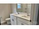 Double vanity bathroom with white cabinets and a large mirror at 102 Obadiah Ct, Troutman, NC 28115