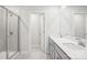 Bathroom featuring double sinks, a glass-enclosed shower, and tile flooring at 102 Obadiah Ct, Troutman, NC 28115