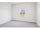 Carpeted bedroom with natural light from the window at 102 Obadiah Ct, Troutman, NC 28115