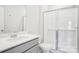 Modern bathroom with a glass-enclosed shower and gray vanity with a white countertop at 103 Obadiah Ct, Mooresville, NC 28115