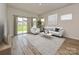 Living room with sliding glass doors leading to backyard at 103 Obadiah Ct, Mooresville, NC 28115