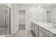 Bathroom featuring a glass-enclosed shower, double vanity, and walk-in closet at 107 Obadiah Ct, Troutman, NC 28115