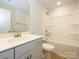 Bathroom with a single sink vanity and tub at 149 Halite Ln, Waxhaw, NC 28173