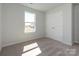 Bedroom with carpet, window and white closet doors at 149 Halite Ln, Waxhaw, NC 28173