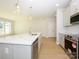 Bright kitchen with stainless appliances, kitchen island, and hardwood flooring at 149 Halite Ln, Waxhaw, NC 28173