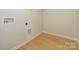 Laundry room with hardwood floors and white walls at 149 Halite Ln, Waxhaw, NC 28173