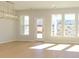 Open, airy living room with large windows and modern light fixtures at 149 Halite Ln, Waxhaw, NC 28173