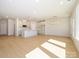 Expansive open-concept living area featuring hardwood floors, recessed lighting, and modern fixtures at 149 Halite Ln, Waxhaw, NC 28173