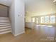 Open floorplan featuring stairs and a light and airy living room at 149 Halite Ln, Waxhaw, NC 28173