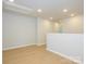Bright, loft area with hardwood floors and recessed lighting, perfect for flexible living at 149 Halite Ln, Waxhaw, NC 28173