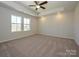 Spacious primary bedroom features tray ceiling, ceiling fan, and abundant natural light at 149 Halite Ln, Waxhaw, NC 28173