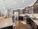 Modern kitchen with stainless steel appliances and granite countertops at 2741 Smethwick Ln, Gastonia, NC 28056