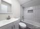 Clean bathroom with white subway tile, a shower/tub combo and vanity at 7324 Pleasant Grove Rd, Charlotte, NC 28216