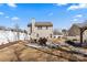 Well-maintained backyard with a fire pit, seating, and a privacy fence at 8007 April Ln, Matthews, NC 28104