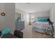 Calming bedroom features pastel-colored furniture, window, closet, and carpet at 8007 April Ln, Matthews, NC 28104
