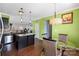 Bright kitchen with stainless steel appliances, granite countertops, dark cabinets and breakfast area at 8007 April Ln, Matthews, NC 28104